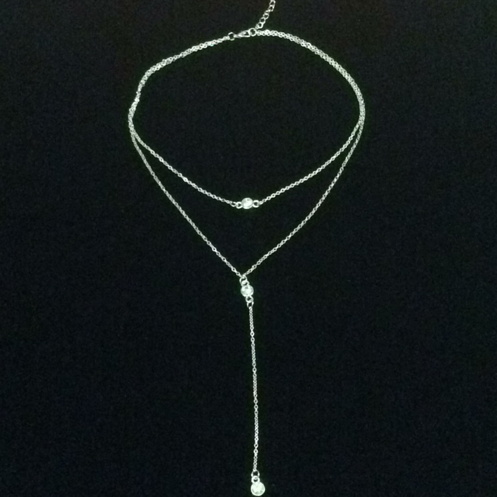 Necklace layered with crystals.